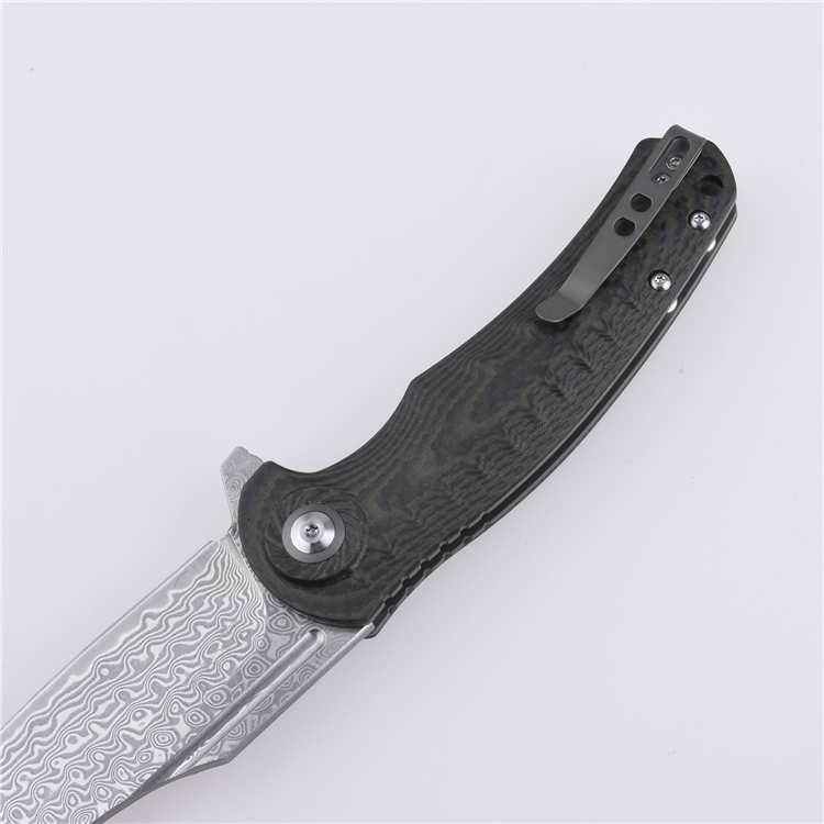 Fancy Drop point Damascus folding knife.